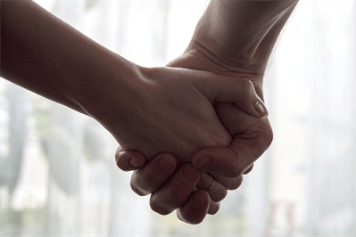 two people holding hands